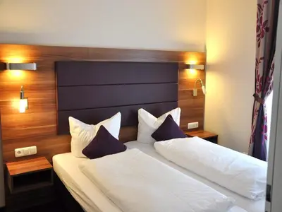 Ein Bett oder Betten in einem Zimmer der Unterkunft BATU Apart Hotel