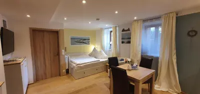 Ein Bett oder Betten in einem Zimmer der Unterkunft Ferienwohnung 1 Rinser mittig in Vogtareuth