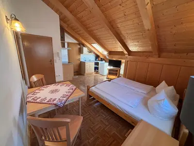 Ein Bett oder Betten in einem Zimmer der Unterkunft Bayersoier Hof