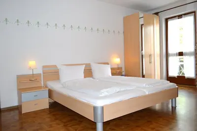 Ein Bett oder Betten in einem Zimmer der Unterkunft Bayersoier Hof