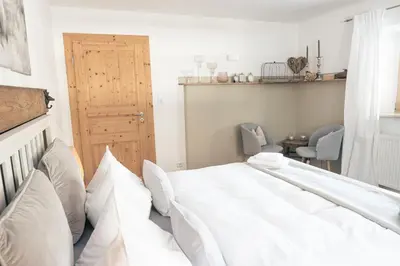 Ein Bett oder Betten in einem Zimmer der Unterkunft Gipfelkönig
