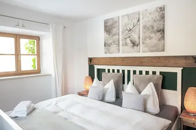 Ein Bett oder Betten in einem Zimmer der Unterkunft Gipfelkönig