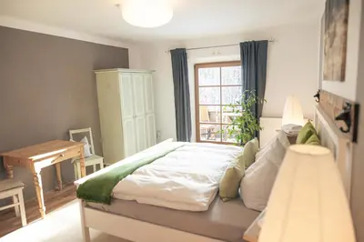 Ein Bett oder Betten in einem Zimmer der Unterkunft Gipfelkönig