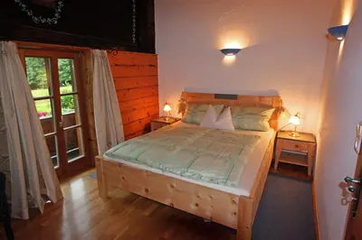 Ein Bett oder Betten in einem Zimmer der Unterkunft Ferienwohnungen Haus Waldwinkel