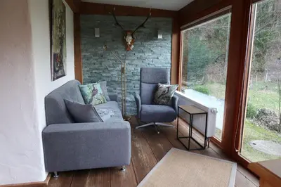 Ein Sitzbereich in der Unterkunft Ferienwohnungen Haus Waldwinkel