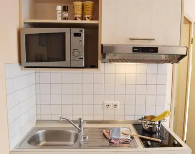 Küche/Küchenzeile in der Unterkunft Mikro Apartments Erding