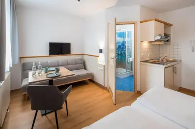 Ein Bett oder Betten in einem Zimmer der Unterkunft Mikro Apartments Erding