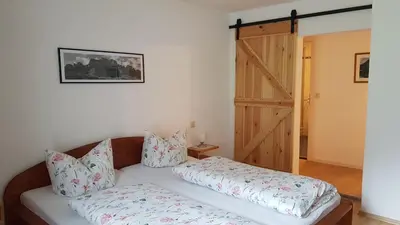 Ein Bett oder Betten in einem Zimmer der Unterkunft Ferienwohnungen Meyerlhof
