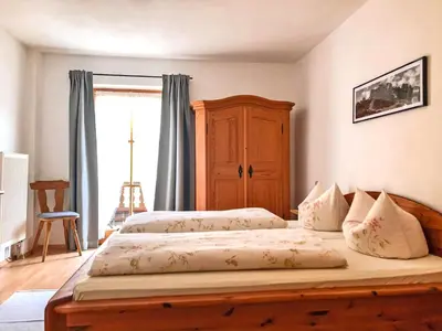 Ein Bett oder Betten in einem Zimmer der Unterkunft Ferienwohnungen Meyerlhof