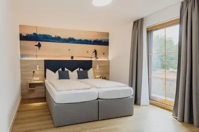 Ein Bett oder Betten in einem Zimmer der Unterkunft Hotel Landgasthof Schöntag