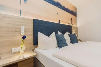 Ein Bett oder Betten in einem Zimmer der Unterkunft Hotel Landgasthof Schöntag