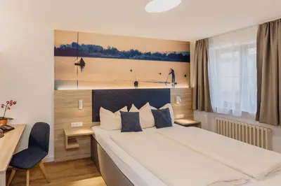 Ein Bett oder Betten in einem Zimmer der Unterkunft Hotel Landgasthof Schöntag