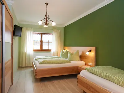 Ein Bett oder Betten in einem Zimmer der Unterkunft Ferienhof Dirnberg