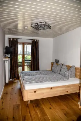 Ein Bett oder Betten in einem Zimmer der Unterkunft Ferienhof Dirnberg