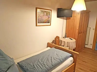 Ein Bett oder Betten in einem Zimmer der Unterkunft Pension Brucker