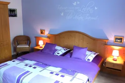 Ein Bett oder Betten in einem Zimmer der Unterkunft Ferienwohnung Kaiserblick