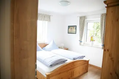 Ein Bett oder Betten in einem Zimmer der Unterkunft Ferienhof Settele