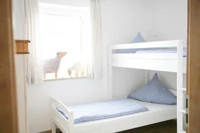 Ein Bett oder Betten in einem Zimmer der Unterkunft Ferienhof Settele