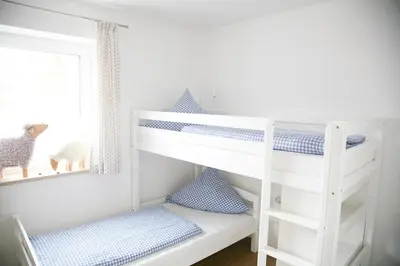 Ein Bett oder Betten in einem Zimmer der Unterkunft Ferienhof Settele