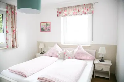 Ein Bett oder Betten in einem Zimmer der Unterkunft Ferienhof Settele