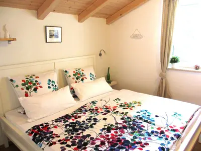 Ein Bett oder Betten in einem Zimmer der Unterkunft Ferienwohnung Schrödel