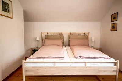 Ein Bett oder Betten in einem Zimmer der Unterkunft Ferienwohnungen Am Strandbad