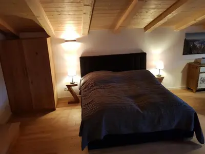 Ein Bett oder Betten in einem Zimmer der Unterkunft Bodenschneid Suiten Neureuthblick