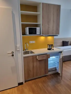 Küche/Küchenzeile in der Unterkunft my MINGA Airport serviced Apartments