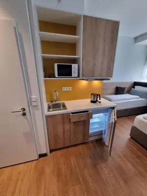 Küche/Küchenzeile in der Unterkunft my MINGA Airport serviced Apartments