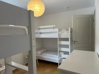 Ein Bett oder Betten in einem Zimmer der Unterkunft Apartment Seeglück am Schliersee - modern, zentral, perfekt für Familien
