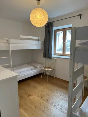 Ein Bett oder Betten in einem Zimmer der Unterkunft Apartment Seeglück am Schliersee - modern, zentral, perfekt für Familien