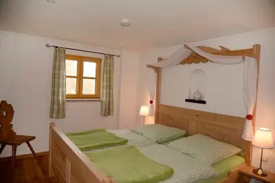 Ein Bett oder Betten in einem Zimmer der Unterkunft Mühle zu Waching