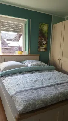 Ein Bett oder Betten in einem Zimmer der Unterkunft Südländische Flair