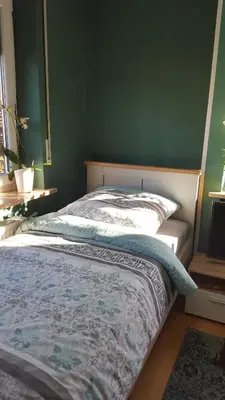 Ein Bett oder Betten in einem Zimmer der Unterkunft Südländische Flair