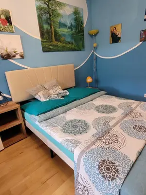 Ein Bett oder Betten in einem Zimmer der Unterkunft Südländische Flair