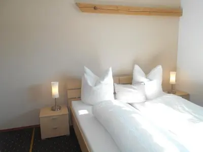 Ein Bett oder Betten in einem Zimmer der Unterkunft Gästehaus Kling