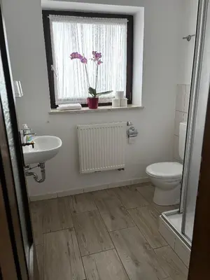 Ein Badezimmer in der Unterkunft Gasthof Schrätzenstaller