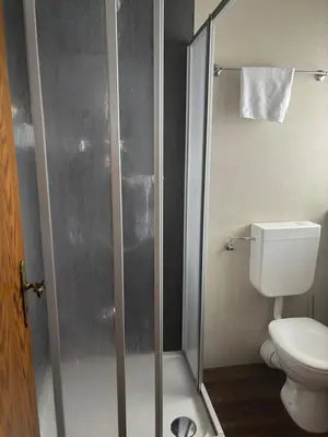 Ein Badezimmer in der Unterkunft Gasthof Schrätzenstaller