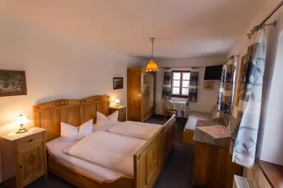 Ein Bett oder Betten in einem Zimmer der Unterkunft Landhaus Griessee