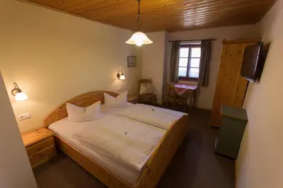 Ein Bett oder Betten in einem Zimmer der Unterkunft Landhaus Griessee