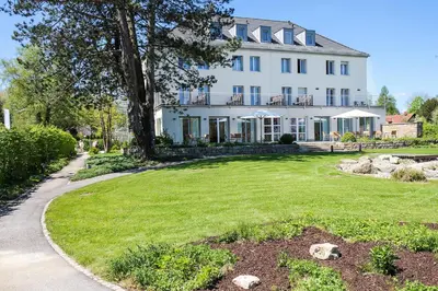 Ein Garten an der Unterkunft Ammerseehäuser