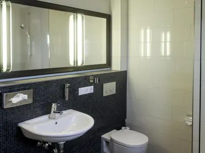Ein Badezimmer in der Unterkunft Parkhotel Heidehof Long Stay