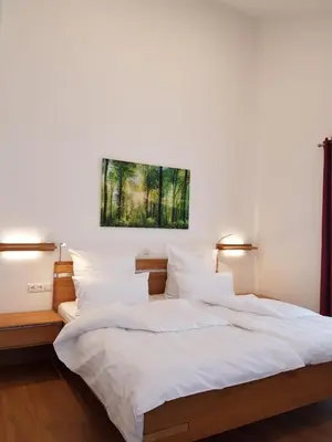 Ein Bett oder Betten in einem Zimmer der Unterkunft Gästehaus Staudenschloss