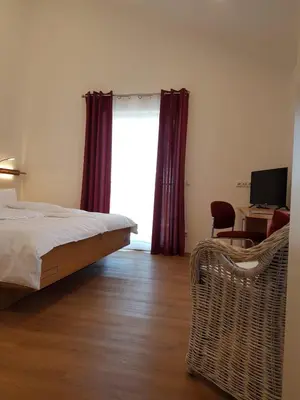 Ein Bett oder Betten in einem Zimmer der Unterkunft Gästehaus Staudenschloss
