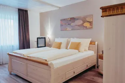 Ein Bett oder Betten in einem Zimmer der Unterkunft Hotel Angermeier GARNI