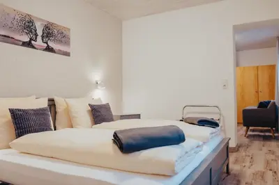 Ein Bett oder Betten in einem Zimmer der Unterkunft Hotel Angermeier GARNI