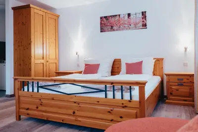 Ein Bett oder Betten in einem Zimmer der Unterkunft Hotel Angermeier GARNI