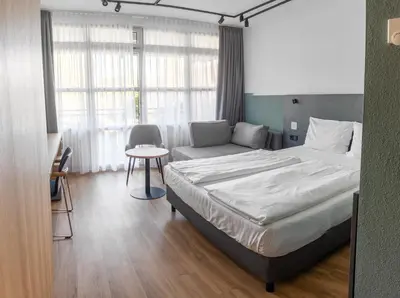 Ein Bett oder Betten in einem Zimmer der Unterkunft Sportschule Oberhaching