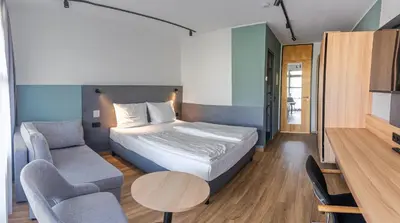 Ein Bett oder Betten in einem Zimmer der Unterkunft Sportschule Oberhaching