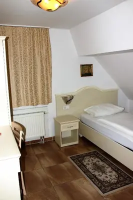 Ein Bett oder Betten in einem Zimmer der Unterkunft Hotel Villa Toscana